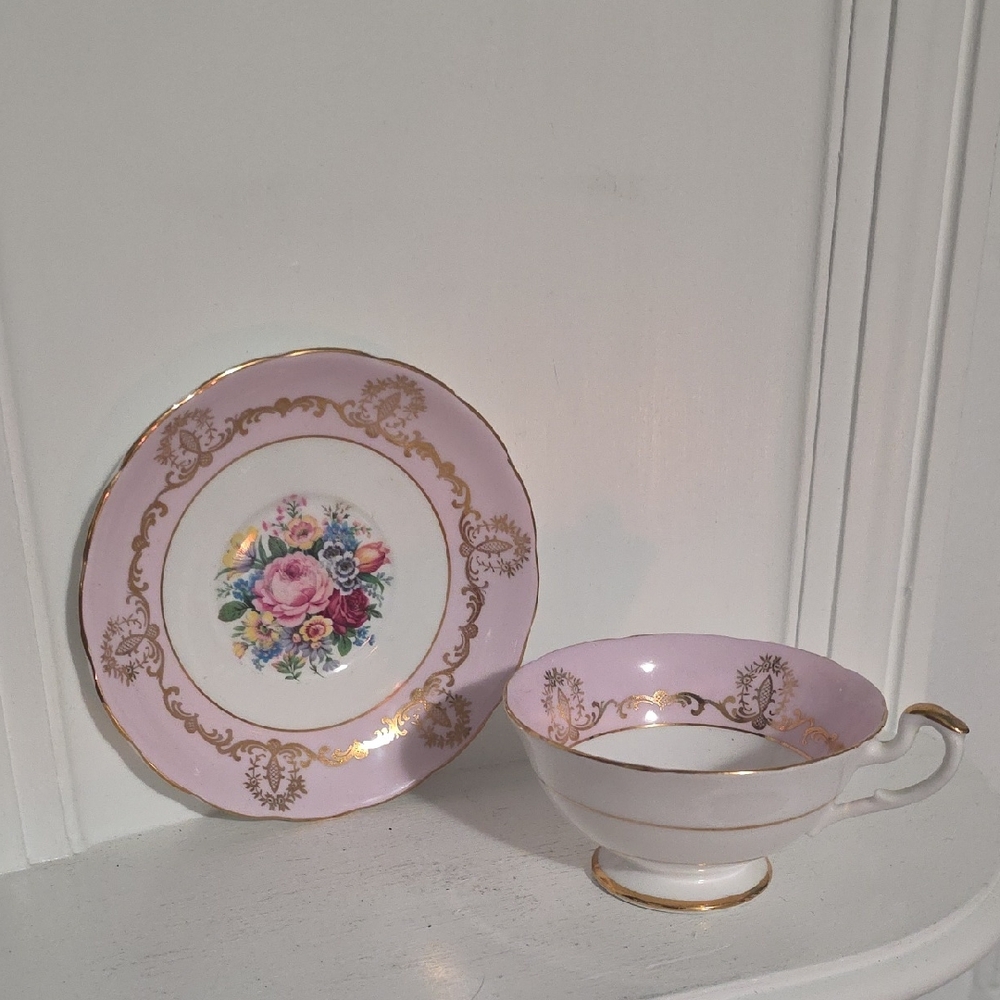 This is a Salisbury pink and floral bouquet teacup and saucer set England